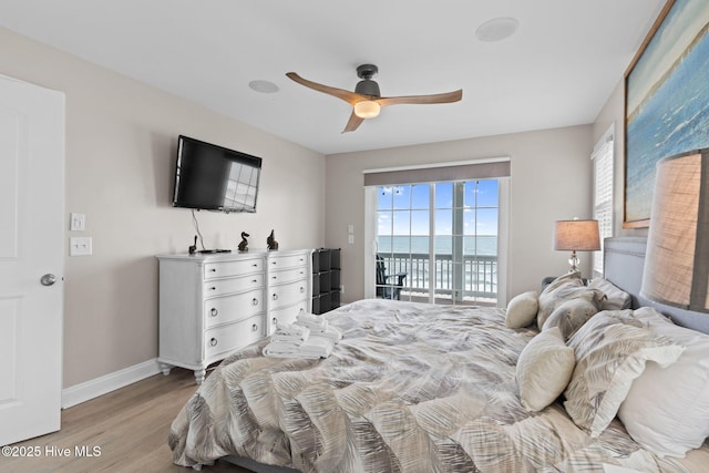 2721 W Beach Dr, Oak Island, NC 28465 - bedroom featuring light wood-style floors, access to outside, baseboards, and a ceiling fan