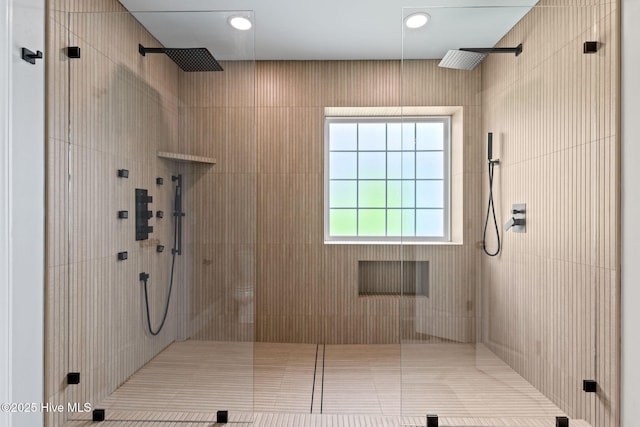 2721 W Beach Dr, Oak Island, NC 28465 - bathroom with a tile shower and tile patterned flooring