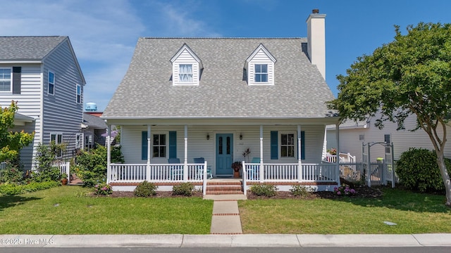 102 Macgregor Dr, Beaufort, NC 28516 - cape cod-style house with a porch, a chimney, and roof with shingles