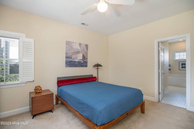 102 Macgregor Dr, Beaufort, NC 28516 - bedroom featuring carpet flooring, baseboards, ensuite bathroom, and a ceiling fan