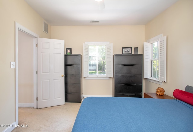 102 Macgregor Dr, Beaufort, NC 28516 - bedroom with freestanding refrigerator, light colored carpet, and baseboards