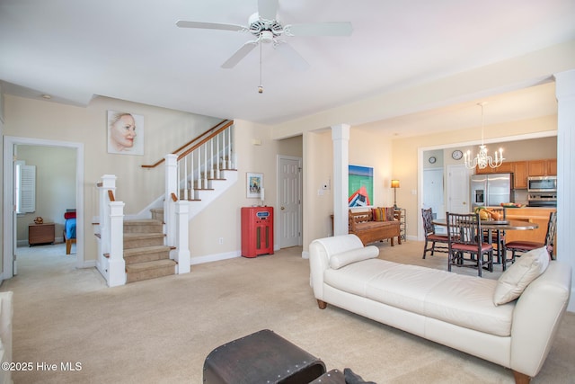 102 Macgregor Dr, Beaufort, NC 28516 - living area with light colored carpet, stairs, ceiling fan, ornate columns, and baseboards
