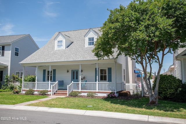 102 Macgregor Dr, Beaufort, NC 28516 - view of front facade with a shingled roof, a porch, and a front lawn