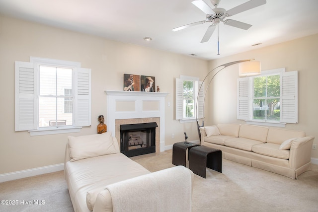 102 Macgregor Dr, Beaufort, NC 28516 - living area with light colored carpet, baseboards, a ceiling fan, and a fireplace