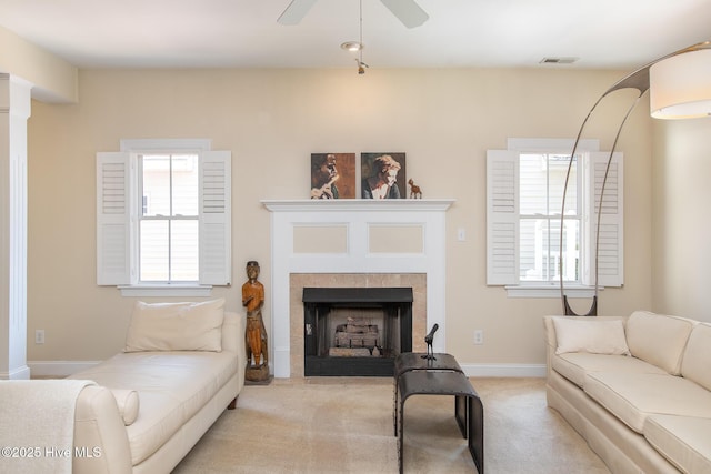 102 Macgregor Dr, Beaufort, NC 28516 - living room featuring carpet, a fireplace, ceiling fan, and healthy amount of natural light