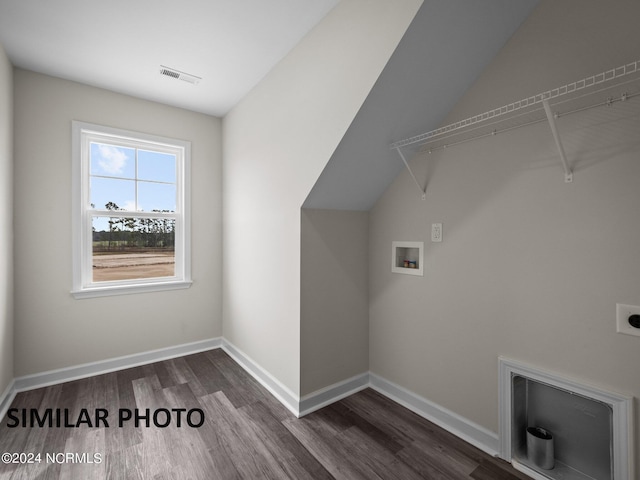 clothes washing area with washer hookup, dark wood-type flooring, and baseboards