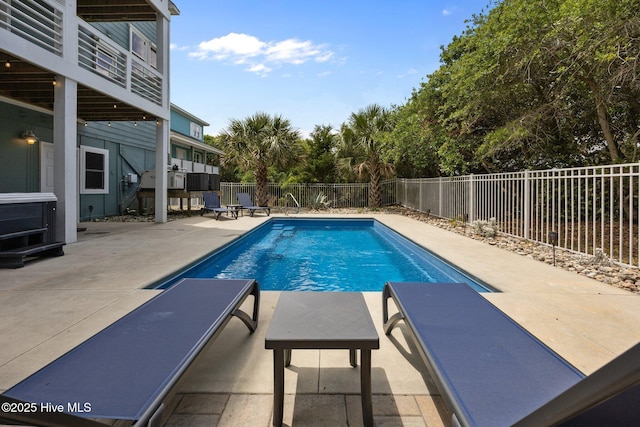 view of pool featuring a patio and a fenced backyard