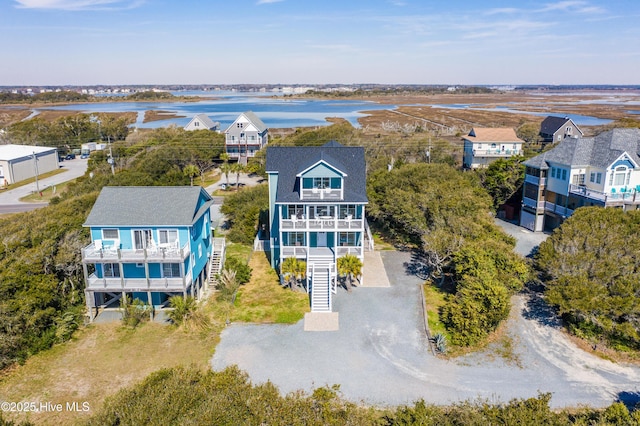 aerial perspective of suburban area with a nearby body of water