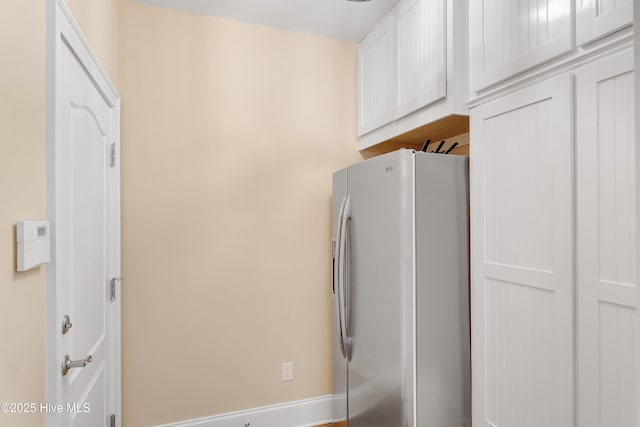 1109 Rollingwood Ct, Leland, NC 28451 - detailed view of refrigerator with ice dispenser and baseboards