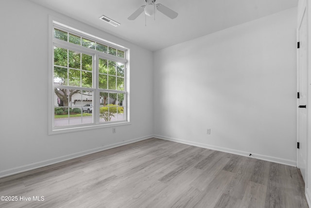 417 Settlers Ln, Kure Beach, NC 28449 - empty room featuring light wood-style flooring, ceiling fan, and baseboards