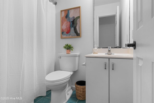 417 Settlers Ln, Kure Beach, NC 28449 - full bath featuring tile patterned floors, toilet, vanity, and a shower with shower curtain