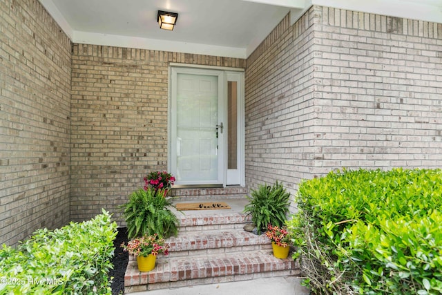 417 Settlers Ln, Kure Beach, NC 28449 - view of exterior entry featuring brick siding