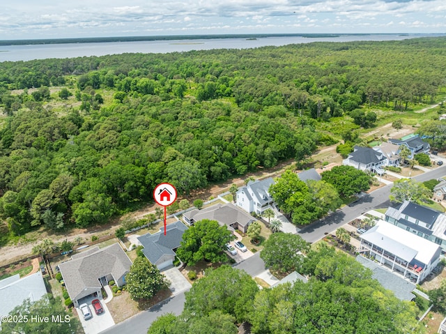 417 Settlers Ln, Kure Beach, NC 28449 - aerial perspective of suburban area with a forest and a large body of water