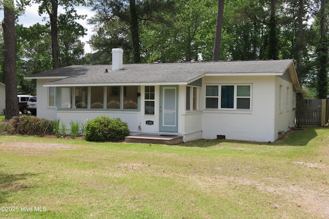 view of front of home featuring a chimney and roof with shingles