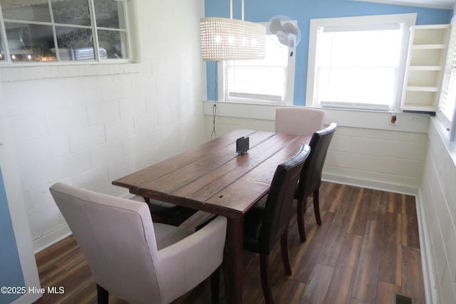 dining area with wood finished floors and healthy amount of natural light