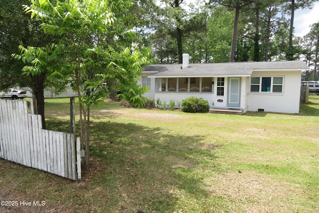 view of front of house with a front lawn and a shingled roof