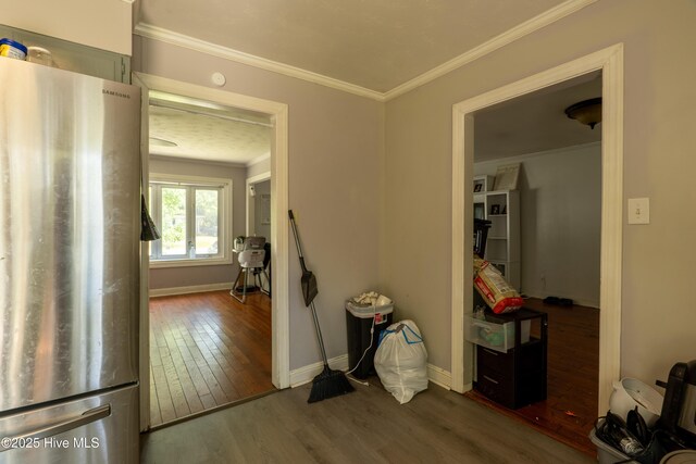 705 Dennis Rd, Jacksonville, NC 28546 - hall featuring ornamental molding, wood finished floors, and baseboards