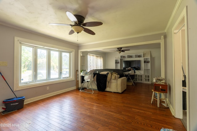 705 Dennis Rd, Jacksonville, NC 28546 - living room with healthy amount of natural light, hardwood / wood-style floors, ceiling fan, and crown molding