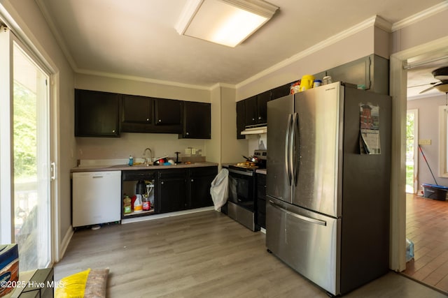 705 Dennis Rd, Jacksonville, NC 28546 - kitchen featuring freestanding refrigerator, white dishwasher, range with electric cooktop, under cabinet range hood, and plenty of natural light