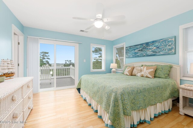 9808 Clarendon Dr, Emerald Isle, NC 28594 - bedroom with light wood finished floors, access to outside, and ceiling fan