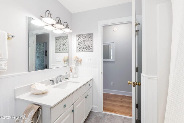 9808 Clarendon Dr, Emerald Isle, NC 28594 - bathroom with a wainscoted wall and vanity