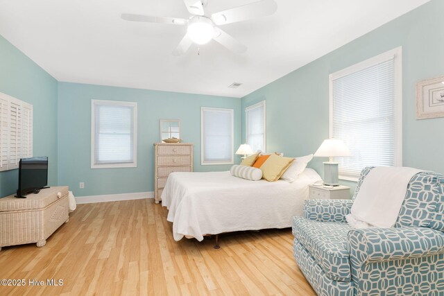 9808 Clarendon Dr, Emerald Isle, NC 28594 - bedroom featuring wood finished floors, baseboards, and a ceiling fan