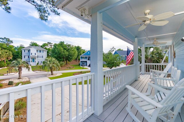 9808 Clarendon Dr, Emerald Isle, NC 28594 - wooden porch featuring ceiling fan and a residential view