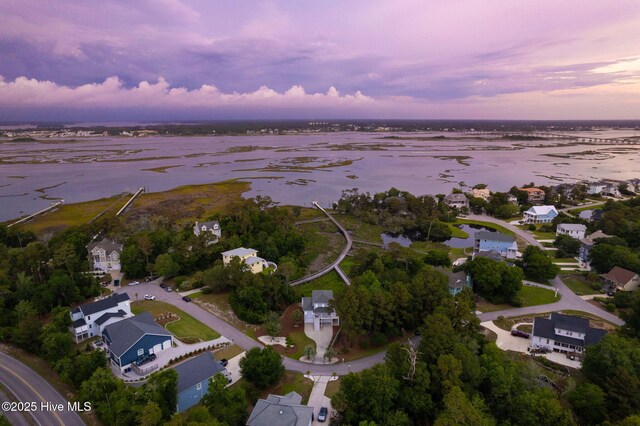 9808 Clarendon Dr, Emerald Isle, NC 28594 - aerial view at dusk of a water view and a residential view