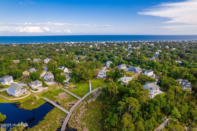 9808 Clarendon Dr, Emerald Isle, NC 28594 - aerial overview of property's location with a nearby body of water and a tree filled landscape