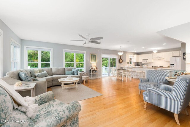 9808 Clarendon Dr, Emerald Isle, NC 28594 - living area with a ceiling fan, light wood finished floors, and recessed lighting