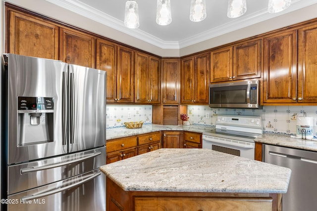 kitchen featuring stainless steel appliances, brown cabinetry, light stone countertops, and ornamental molding