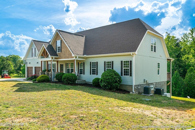 8295 Antioch Church Rd, Middlesex, NC 27557 - view of front facade with a front lawn, a garage, cooling unit, and roof with shingles