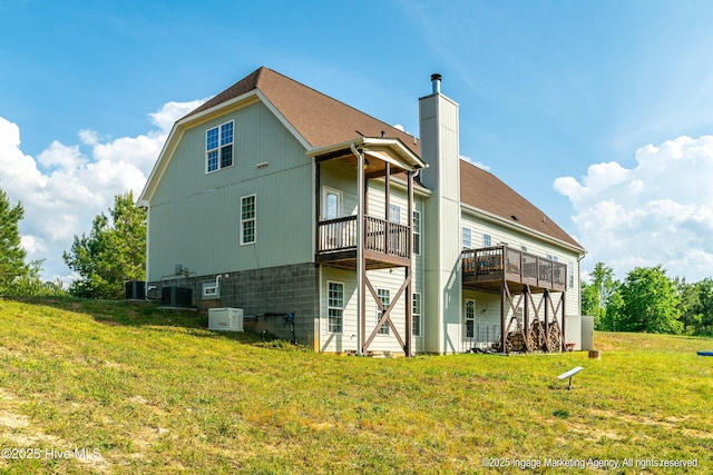 8295 Antioch Church Rd, Middlesex, NC 27557 - rear view of property with a yard, a chimney, central air condition unit, a deck, and a shingled roof