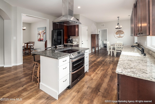 8295 Antioch Church Rd, Middlesex, NC 27557 - kitchen with island range hood, range with two ovens, a chandelier, a sink, and recessed lighting