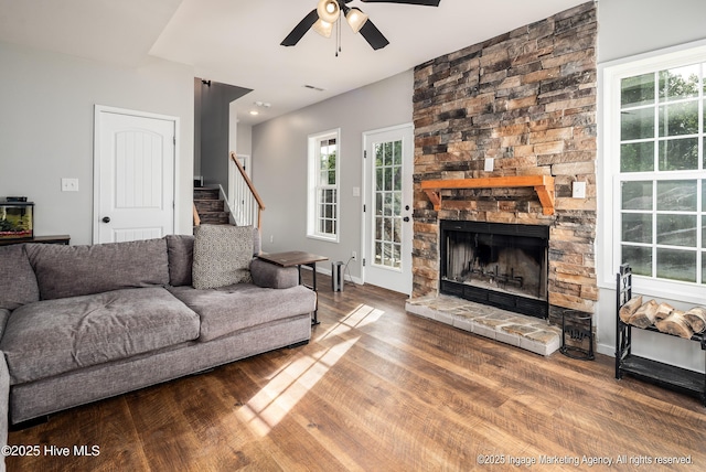 8295 Antioch Church Rd, Middlesex, NC 27557 - living area with a ceiling fan, stairway, wood finished floors, and a stone fireplace