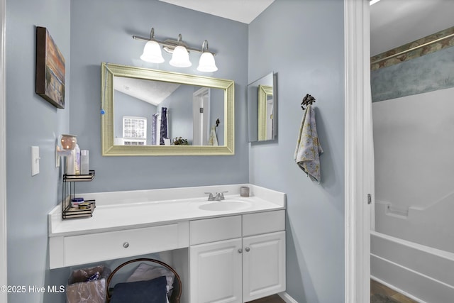 full bath featuring vanity and a shower