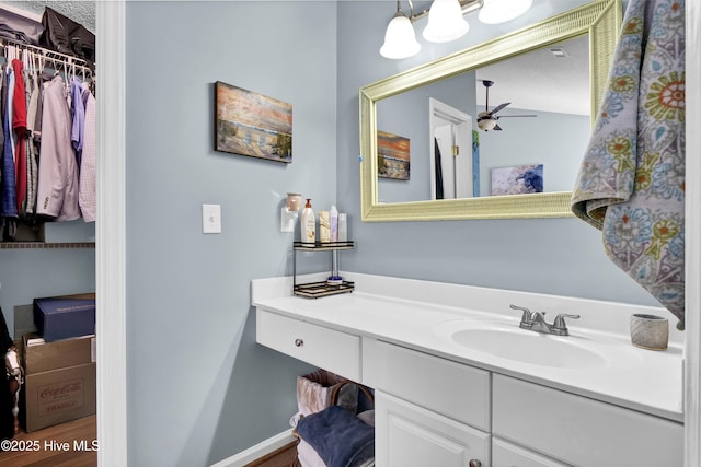 bathroom featuring vanity and ceiling fan