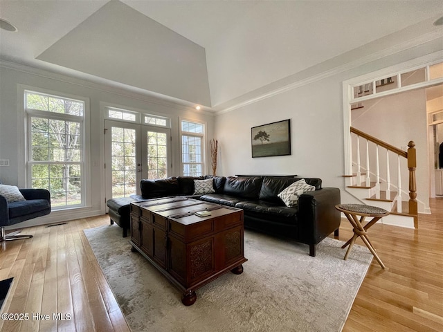 50 Short Rd, Pinehurst, NC 28374 - living area with light wood finished floors, ornamental molding, stairs, a towering ceiling, and french doors