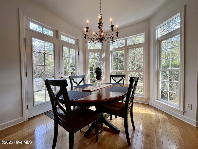 50 Short Rd, Pinehurst, NC 28374 - dining area with light wood finished floors, a chandelier, and french doors
