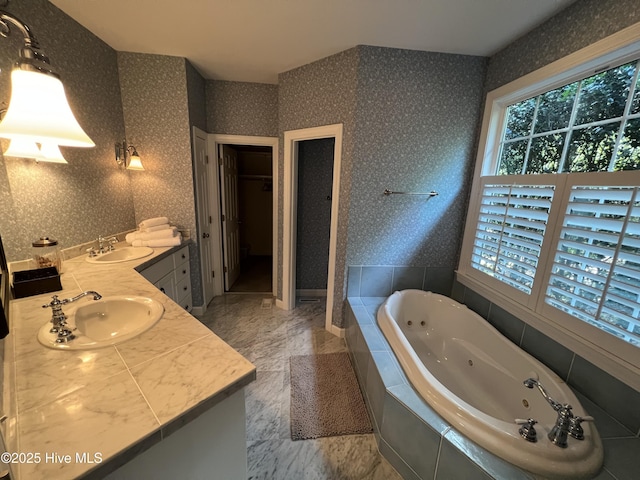 50 Short Rd, Pinehurst, NC 28374 - full bathroom with double vanity, wallpapered walls, a whirlpool tub, and marble finish flooring