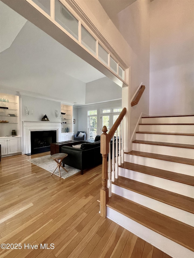 50 Short Rd, Pinehurst, NC 28374 - living area featuring light wood-type flooring, a fireplace, stairway, and built in features
