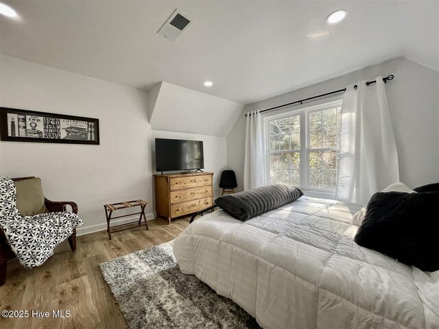 50 Short Rd, Pinehurst, NC 28374 - bedroom with lofted ceiling, wood finished floors, and recessed lighting