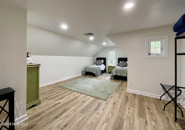 50 Short Rd, Pinehurst, NC 28374 - bedroom with wood finished floors, multiple windows, vaulted ceiling, and recessed lighting