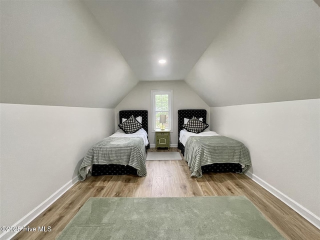 50 Short Rd, Pinehurst, NC 28374 - bedroom featuring vaulted ceiling and wood finished floors