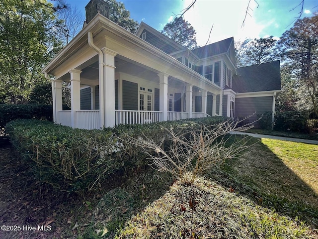 50 Short Rd, Pinehurst, NC 28374 - view of property exterior featuring a chimney and a porch