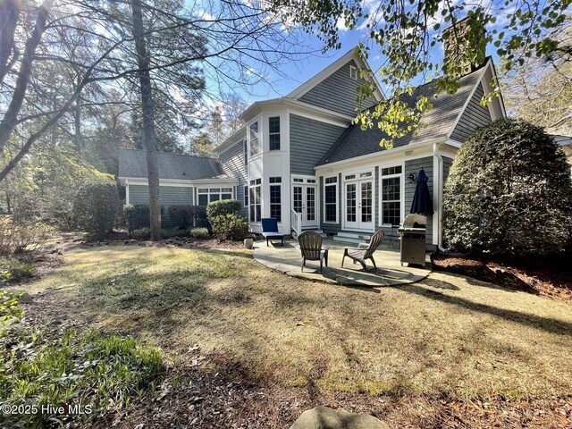 50 Short Rd, Pinehurst, NC 28374 - back of house featuring a patio area, french doors, a lawn, and roof with shingles