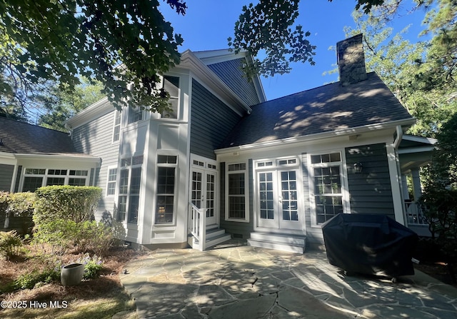 50 Short Rd, Pinehurst, NC 28374 - back of property with french doors, entry steps, a patio, and a chimney