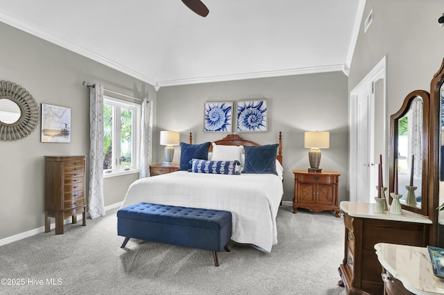 bedroom with carpet floors, ornamental molding, baseboards, and a ceiling fan