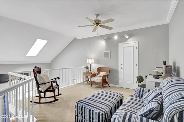 living area featuring ceiling fan, light carpet, vaulted ceiling, a skylight, and crown molding