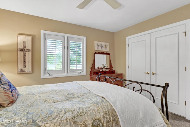 carpeted bedroom featuring a closet and ceiling fan